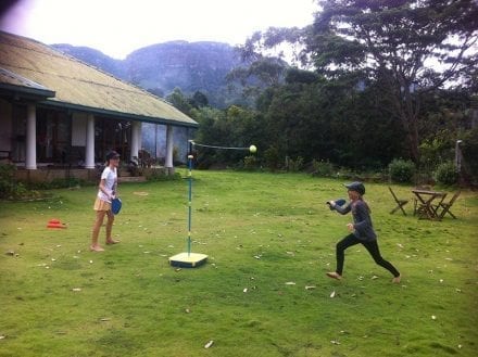 Jungle Tide Kandy B&B has lots of outdoor games for all the family - 2 girls playing swing ball on the lawn